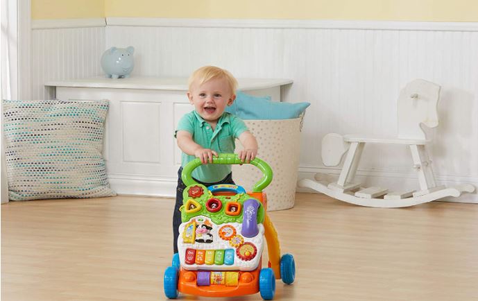 Kid walking with VTech Sit to Stand Learning Walker
