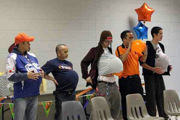 Guys playing games in Baby shower