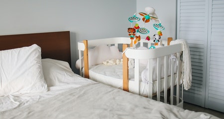 White baby cribs and bed in bright bed room
