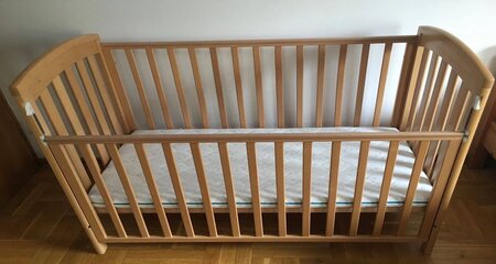 Baby Crib with white lower crib mattress