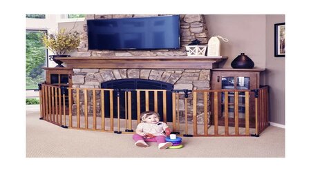 Babysitting next to the fireplace area that covered with Pressure Mounted Baby Gate