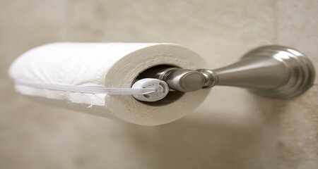 toilet paper wraping with a rubber band