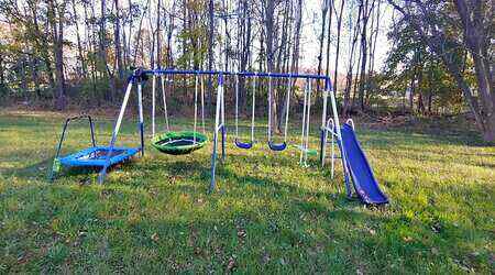 Sports power Rosemead Metal Trampolines with Swing Set on the field