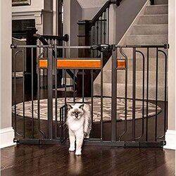A cat is crossing the baby gate through cat door