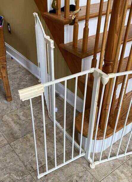 installing a baby gate to the spiral staircase