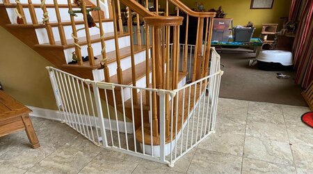 Curved baby gate around spiral staircase