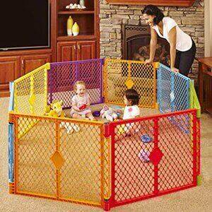 Kids are playing inside Toddleroo by North States Superyard Play Yard