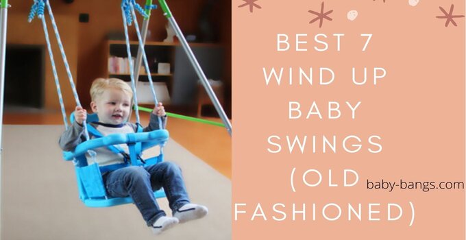 A kid is sitting on a wind up baby swing