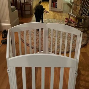 My wooden freestanding baby gate in the living room