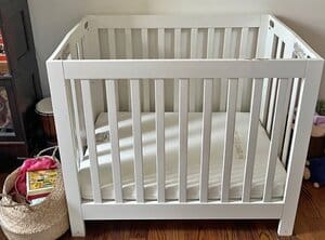 Babyletto Portable Crib in the room