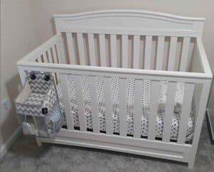 Tall white Baby Crib in the room