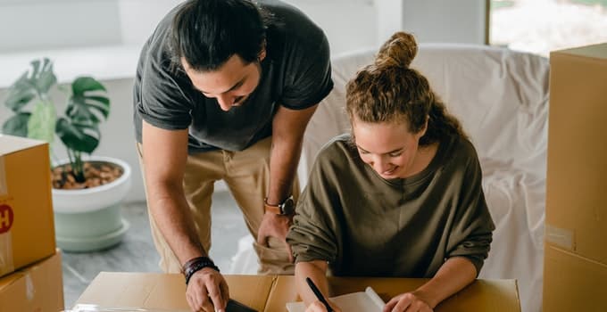 Couple packing the furniture before moving out from the apartment