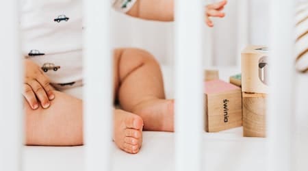 Baby Sitting in a Crib