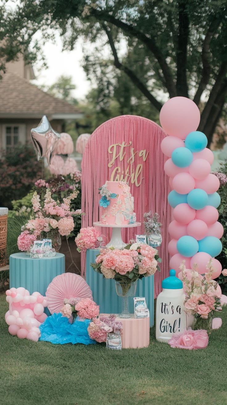 Colorful baby shower setup with balloons, flowers, and a cake, outdoors.